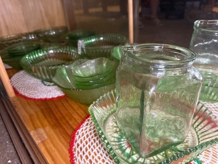 Shelf lot of green glass bowls dishes etc