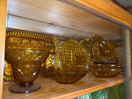 Shelf lot of Amber Carnival glass