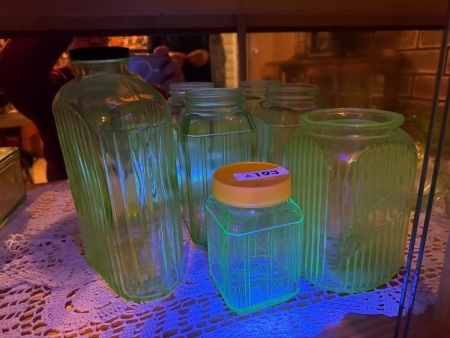 Assortment of green uranium/glow glass bottles - largest bottle has crack