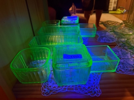 Assortment of green uranium/glow glass butter dishes