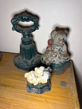 3x small cast iron door stoppers
