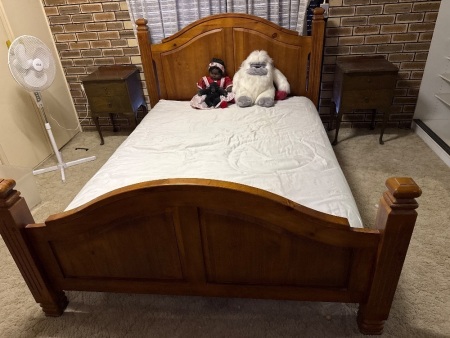 Wooden double bed with mattress
