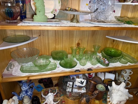 Shelf lot of mostly green glass items