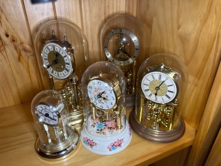 Five replica anniversary clocks