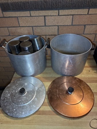 Two large aluminium cooking pots with stainless steel pots