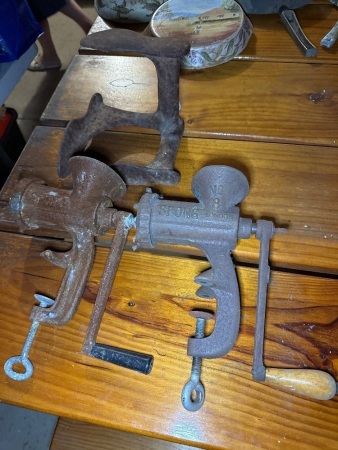 Two vintage meat mincers and shoe last