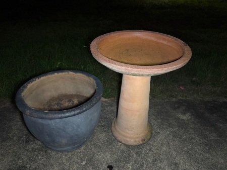 Terracotta birdbath and a pot