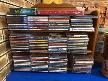 Assorted CDs and wall shelf