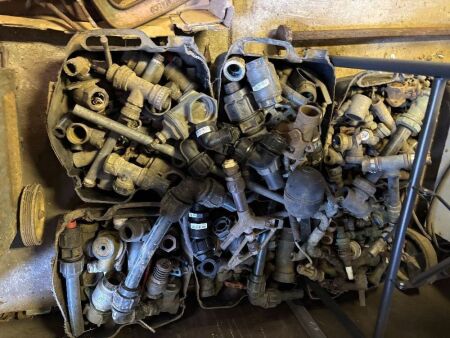 Assorted poly, brass, and metal irrigation fittings