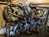 Assorted poly, brass, and metal irrigation fittings