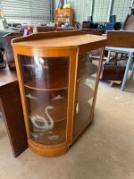 Bow front display cabinet with etched swan