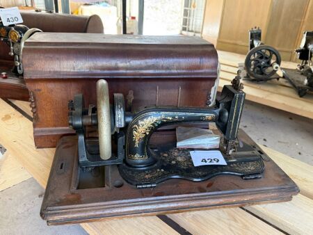 Unmarked sewing machine with case