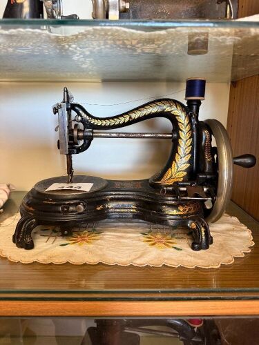 JONES hand cranked sewing machine on paw foot cast iron base