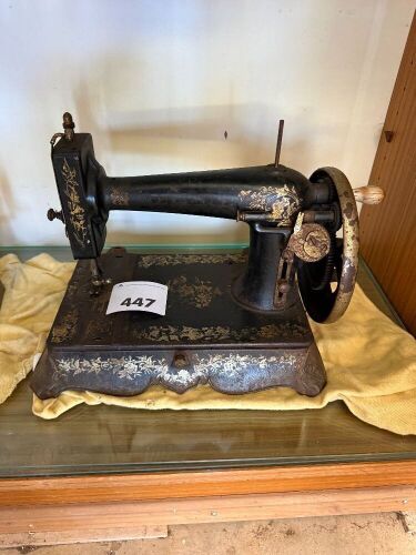 Unbranded sewing machine on cast iron footed base