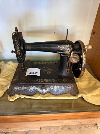 Unbranded sewing machine on cast iron footed base