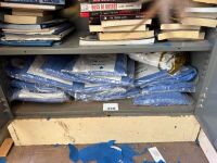 Shelf lot of disposable overalls