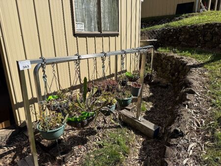 2 stainless steel stands with plants/baskets/pots