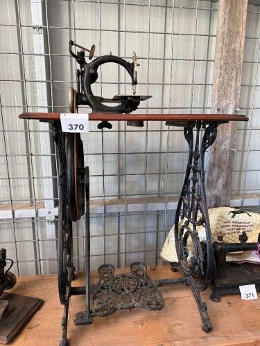 Willcox and Gibbs sewing machine on cast iron treadle base