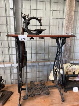 Willcox and Gibbs sewing machine on cast iron treadle base