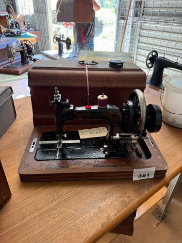 Frister and Rossman hand cranked sewing machine with case