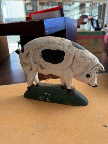 Cast iron pig door stopper