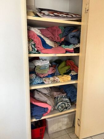 5 shelves of mostly material items