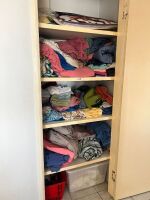 5 shelves of mostly material items