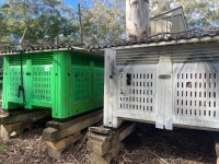 2x plastic containers with firewood