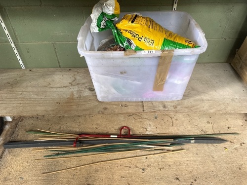 Tub of fertiliser plus garden stakes etc.