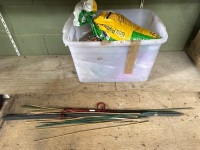 Tub of fertiliser plus garden stakes etc.