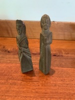 Pair of Carved Granite Pilgrim Style Figures