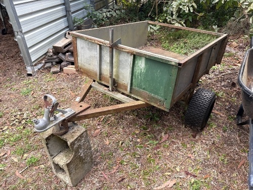 Small tow behind metal tipping yard trailer