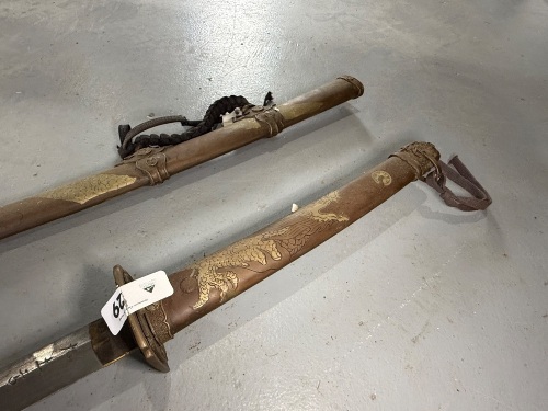 Marked Japanese ceremonial sword with Damascus style blade and incised copper and Brass handle and scabbard