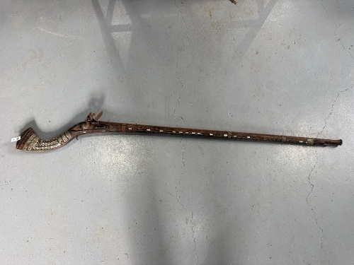 Antique long barrel match lock rifle with decorative inlays