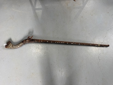 Antique long barrel match lock rifle with decorative inlays