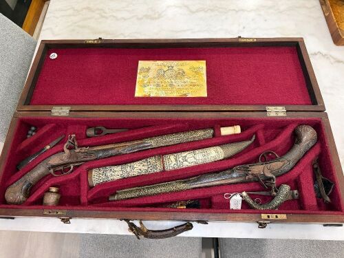 Antique flintlock/miquelet style pistols and matching dagger and sheath in felt lined wooden case