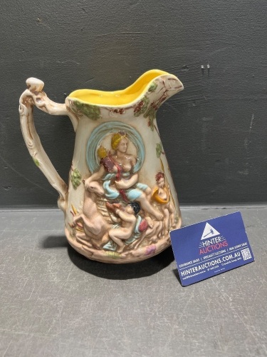 Italian Glazed Pitcher with High Relief Cherub Design Possibly Hand-Painted