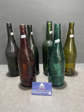 Assorted coloured beer bottles