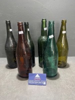 Assorted coloured beer bottles