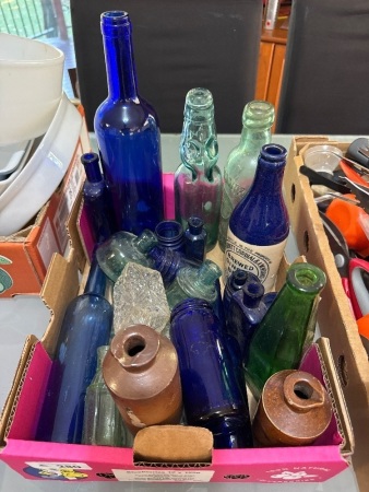 Assorted vintage glass and stoneware bottles