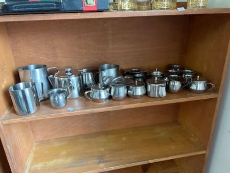 Shelf Lot of Metal Barista Jugs and Shot Cups