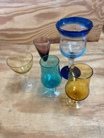 Box lot of mixed coloured glass drinking glasses