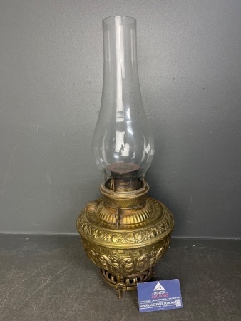 Ornate embossed brass centre draft oil lamp