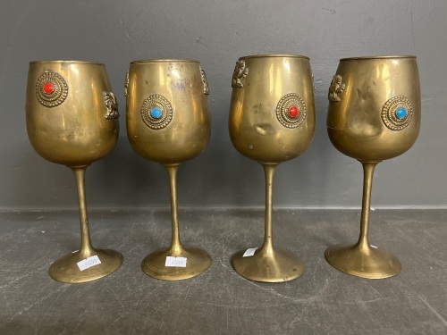 Four brass goblets griffin mounts coloured stones