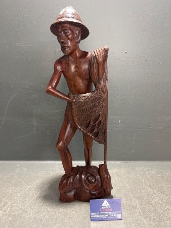 Carved hardwood fisherman figure with net