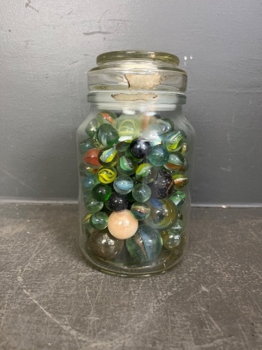 Glass jar of assorted marbles