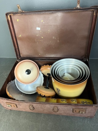 Aluminium picnic bowls cups and lidded jars in suitcase