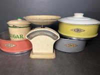 Anodized Kitchen Scales, Set of Canisters and a Stack of Cake Tins