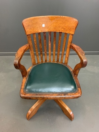 Antique Oak Captains / Office Swivel Elbow Chair with Leathered Seat and Brass Tacks