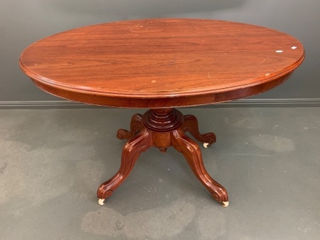 Antique Red Cedar Tilt Top Table on Carved Scrolled Legs with Original Casters
